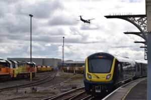 Eastleigh Train Station with a plane flying overhead