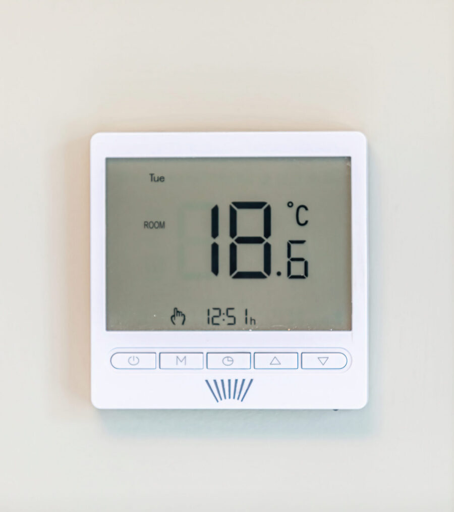 A thermostat on a wall